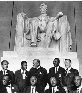  ?? National Archives ?? Rep. John Lewis, back row, second from left, and other civil rights leaders gathered in front of the Lincoln Memorial during the March on Washington in 1963.