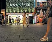  ?? SEONGJOON CHO/BLOOMBERG 2015 ?? South Korea’s Amorepacif­ic Corp. is set to millenials by selling innisfree. start targeting