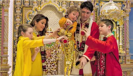  ??  ?? Canadian Prime Minister Justin Trudeau and his family perform abhishek of Shri Nilkanth Varni.