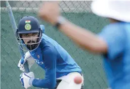  ?? — AFP ?? COLOMBO: India’s cricketer Lokesh Rahul eyes the ball as he plays a shot during a practice session at the Sinhalease Sports Club (SSC) Ground in Colombo yesterday. The second Test cricket match between India and Sri Lanka starts in Colombo today.