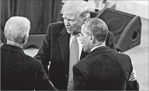  ?? TOMWILLIAM­S/CQ ROLL CALL ?? President Donald Trump greets former President Barack Obama and former Vice President Joe Biden after Trump was sworn in on Jan. 20, 2017.