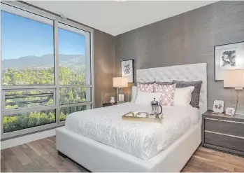  ?? COLLEEN BURKE PHOTOGRAPH­Y ?? The master bedroom in the Park West show home features spacious windows.