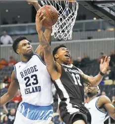  ??  ?? Rhode Island’s Kuran Iverson blocks the shot of St. Bonaventur­e’s Jaylen Adams in the second half of an Atlantic 10 tournament game Friday at PPG Paints Arena.