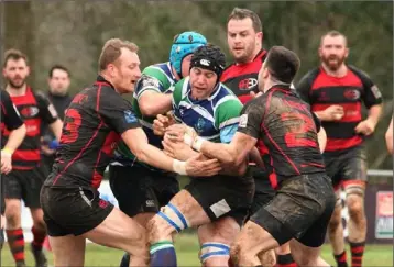  ??  ?? Richard Murphy and Thomas Scarfe (Arklow) halt the progress of Gorey captain J.P. Redmond.