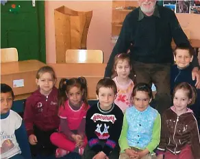  ??  ?? Compassion: Tony Arthur visits an orphanage in Hungary