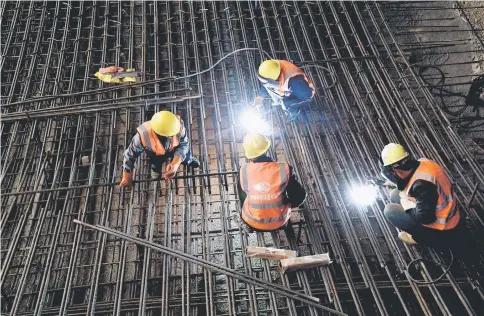  ??  ?? Workers weld steel bars at the constructi­on site of a Tencent data centre in a tunnel in Guian, Guizhou province, China Mar 13. This month, President Donald Trump tweeted, “If you don’t have steel, you don’t have a country!” Sounds great, but maybe he...