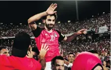  ?? NARIMAN EL-MOFTY/THE ASSOCIATED PRESS ?? Egypt’s Mohamed Salah was carried off the pitch by teammates after scoring the winner in a 2-1 victory over the Republic of Congo that earned Egypt a spot in the World Cup.