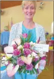  ??  ?? Above, Yvonne Neville with her winning entry. Top and right, entries in the various flower categories. Right, from left, Kevin Lambert, Daphne Andrews, Dorothy Athow, Yvonne Neville, Ann Harris, Richard Copland