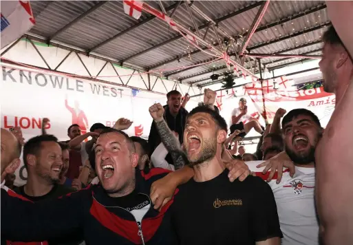  ?? Photos: James Beck/ Adam Hughes / SWNS ?? Left, England fans celebrate at The Three Lions pub on West Street in Bristol; below, fans watch the Euro 2020 game between England and Germany at Ashton Gate stadium