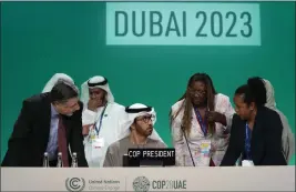  ?? PETER DEJONG — THE ASSOCIATED PRESS ?? COP28 President Sultan al-Jaber, center, and COP28 CEO Adnan Amin speak at the COP28U.N. Climate Summit on Saturday in Dubai, United Arab Emirates.