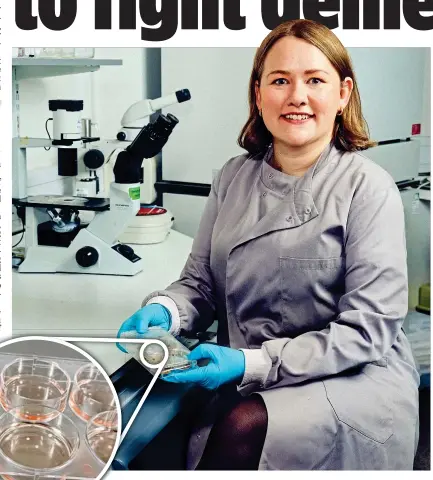  ?? ?? REVOLUTION­ARY: Professor Selina Wray with a petri dish containing the ‘mini-brains’,