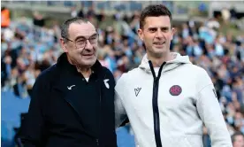  ?? Paolo Bruno/Getty Images ?? Maurizio Sarri (left), the head coach of Lazio, embraces Bologna’s Thiago Motta. Photograph: