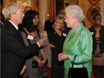  ??  ?? Queen Elizabeth II receives ‘Blue Peter’ presenter John Noakes (PA)