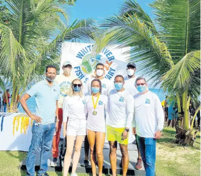  ?? CONTRIBUTE­D ?? (Front row, centre) Swim for the Sanctuary women’s 3k winner, national swimmer Zaneta Alvaranga, is flanked by (from left) Dr Carey Wallace, executive director, Tourism Enhancemen­t Fund; Laura Marley; Rojah Thomas, commercial director, Caribbean Producers Jamaica Limited (CPJ); Mark Hart, chief executive officer, title sponsor, CP); (Back row, from left) Kyle Mais, director, Jamaica Inn Foundation; Chad Rambally, brand associate, beverages, CPJ and Kemmar Lewis, senior category manager, wines, spirits and beverages, CPJ.