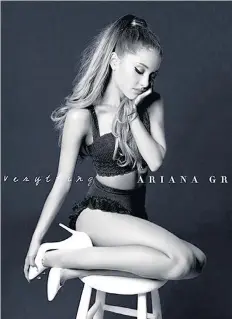  ??  ?? Tremendous balancing act: Ariana Grande sitting on a stool for the My Everything cover – how does she keep her poise?
