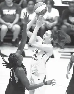  ?? Julie Jacobson/Associated Press file photo ?? ■ Seattle Storm forward Breanna Stewart (30) shoots over New York Liberty center Tina Charles (31) during the third quarter of a WNBA basketball game on July 3 in White Plains, N.Y.