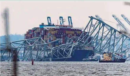  ?? REUTERS PIC ?? A view of the Dali cargo vessel, following the collapse of the Francis Scott Key Bridge, in Baltimore, Maryland, United States, on Thursday.