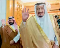  ?? — AP file ?? Saudi King Salman and Defence Minister and Deputy Crown Prince Mohammed bin Salman wave as they leave the hall after talks with the British prime minister in Riyadh.