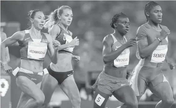  ?? THE ASSOCIATED PRESS ?? South Africa’s Caster Semenya leads the field on the way to a gold medal in the women’s 800-metre final in Rio on Saturday. Canada’s Melissa Bishop, second from left, set a Canadian record, with a time of 57.02 seconds, but it wasn’t enough to get on...