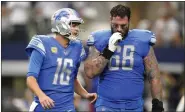  ?? TONY GUTIERREZ — THE ASSOCIATED PRESS ?? Detroit Lions QB Jared Goff (16) talks to offensive tackle Taylor Decker after running back Jamaal Williams fumbled at the 1-yard line during the second half of last month’s game against the Dallas Cowboys in Arlington, Texas.