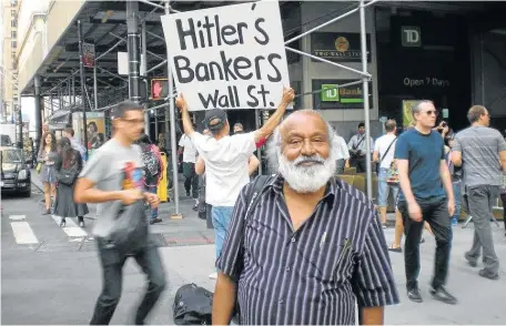  ??  ?? MIXED MESSAGE: Chengiah Rogers Ragaven at a protest in the US last year