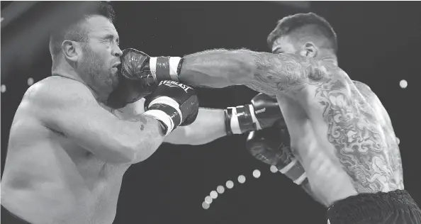  ?? ED KAISER ?? Adam Braidwood connects with Tim Hague’s jaw during the KO 79 boxing event at the Shaw Centre in Edmonton on June 16. Hague collapsed in the ring and died shortly after.