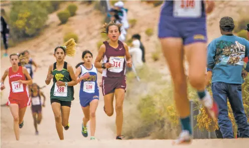  ?? NEW MEXICAN FILE PHOTOS ?? Pecos’ Vanessa Dominguez, second from left, is an underclass­man who could help lead the Lady Panthers this year.