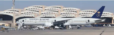  ??  ?? Left: Riyadh airport is home port for Saudi Arabian Airlines. Below: Aerial view of Riyadh downtown