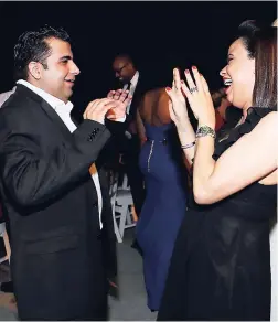  ??  ?? Rosh Ramchandan­i dancing with Aida Carolina Urena Mendez.