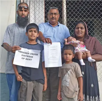  ?? Photo: Mereleki Nai ?? From left: Zainal Khan, Zayaan Khan (son), registered bailiff, Reggie Ali, Zohan Khan (son), Zaima Khan (wife of Zainal) with their one-month-old daughter, Zahraa Khan at their home at Alla Datta in Nadi.