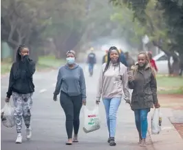  ?? DENIS FARRELL/AP ?? Students at Tshwane University of Technology, which has emerged as a hot spot in Pretoria, South Africa. The variant has fueled a surge of COVID-19 cases in the nation.