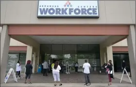  ?? (Arkansas Democrat-Gazette/Stephen Swofford) ?? People wait in line to file for unemployme­nt Friday at the Little Rock office of the state Division of Workforce Services. Arkansas’ jobless rate hit 10.2% in April.