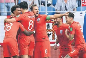  ?? AFP ?? England's Dele Alli (top left) celebrates with skipper Harry Kane and teammates after scoring the second goal against Sweden in the quarterfin­al in Samara on Saturday.