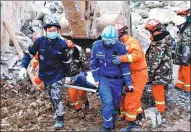  ?? XINHUA ?? Rescuers retrieve a body from the rubble on Sunday after a landslide destroyed part of a hotel in Nanzhang county, Hubei province, on Friday.