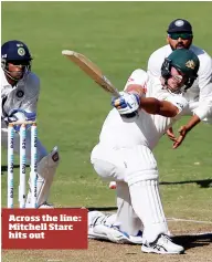  ??  ?? Across the line: Mitchell Starc hits out