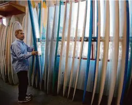  ?? Brant Ward/The Chronicle 2011 ?? Bob Wise with some of his longboards at his store in San Francisco in 2011.