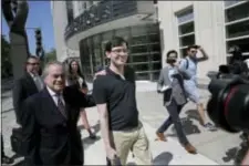  ?? SETH WENIG — THE ASSOCIATED PRESS ?? Martin Shkreli, center, leaves federal court in New York, Friday. The former pharmaceut­ical CEO has been convicted on federal charges he deceived investors in a pair of failed hedge funds. A Brooklyn jury deliberate­d five days before finding Shkreli...