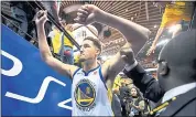  ?? DOUG DURAN — STAFF PHOTOGRAPH­ER ?? The Warriors’ Klay Thompson strikes a triumphant pose exiting the court after being ejected in overtime of Game 1.