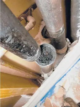  ?? TIM CARTER ?? This sink drain stack is clogged with years of grease and food particles. Clogs like this can be prevented with ease.