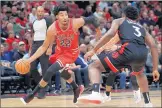  ?? CHRIS SWEDA / CHICAGO TRIBUNE ?? Otto Porter Jr. drives on Toronto Raptors forward OG Anunoby during a 2019 game. Sunday’s game between the Bulls and the Raptors was postponed.