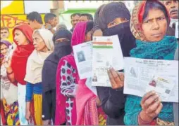  ?? PTI PHOTO ?? Women queue up at a polling booth in Amethi during the fifth phase of assembly elections in Uttar Pradesh on Monday.