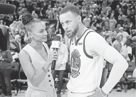  ?? JEFF CHIU/AP ?? ESPN reporter Malika Andrews, left, interviews Golden State Warriors guard Steph Curry after Game 4 in the first round of the NBA playoffs.