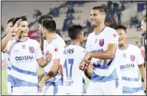  ??  ?? Odisha players celebrate victory over Hyderabad FC.