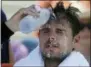  ?? SETHWENIG — THE ASSOCIATED
PRESS ?? Stan Wawrinka, of Switzerlan­d, pours water on his face during a changeover in his match against Ugo Humbert, of France, during the second round of the U.S. Open tennis tournament, Wednesday in New York.