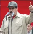  ?? AFP ?? CARACAS: Venezuelan President Nicolas Maduro delivers a speech during the seventh anniversar­y of the Bolivarian Militia in Caracas. Venezuela’s defense minister on Monday declared the army’s loyalty to Maduro, who ordered troops into the streets ahead...