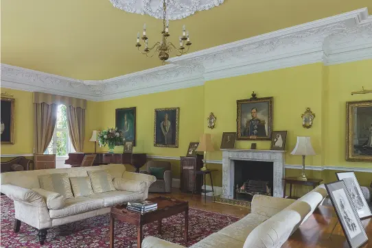  ??  ?? Fig 4: The main drawing room with its rich Edwardian plasterwor­k. Above the fireplace is the portrait of George VI