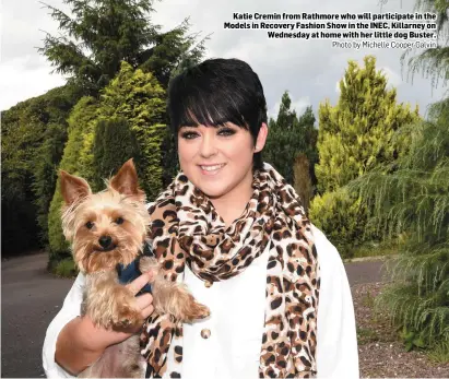  ?? Photo by Michelle Cooper Galvin ?? Katie Cremin from Rathmore who will participat­e in the Models in Recovery Fashion Show in the INEC, Killarney on Wednesday at home with her little dog Buster.