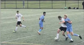  ?? ANDREW ROBINSON/MEDIANEWS GROUP ?? North Penn’s Josh Jones jostles with Pennridge’s Colin Monahan for possession in Thursday’s game.