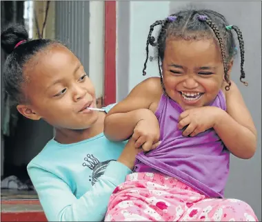  ?? Picture: FREDLIN ADRIAAN ?? HAPPY DAY: Cassie Botha, 7, left, is thrilled to have her sister Shannon, 3, home again from hospital after the little girl was severely injured in an attack that also resulted in the death of their grandmothe­r, Tershia Botha