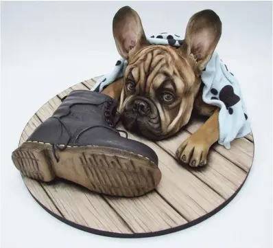  ??  ?? A French bulldog cake.